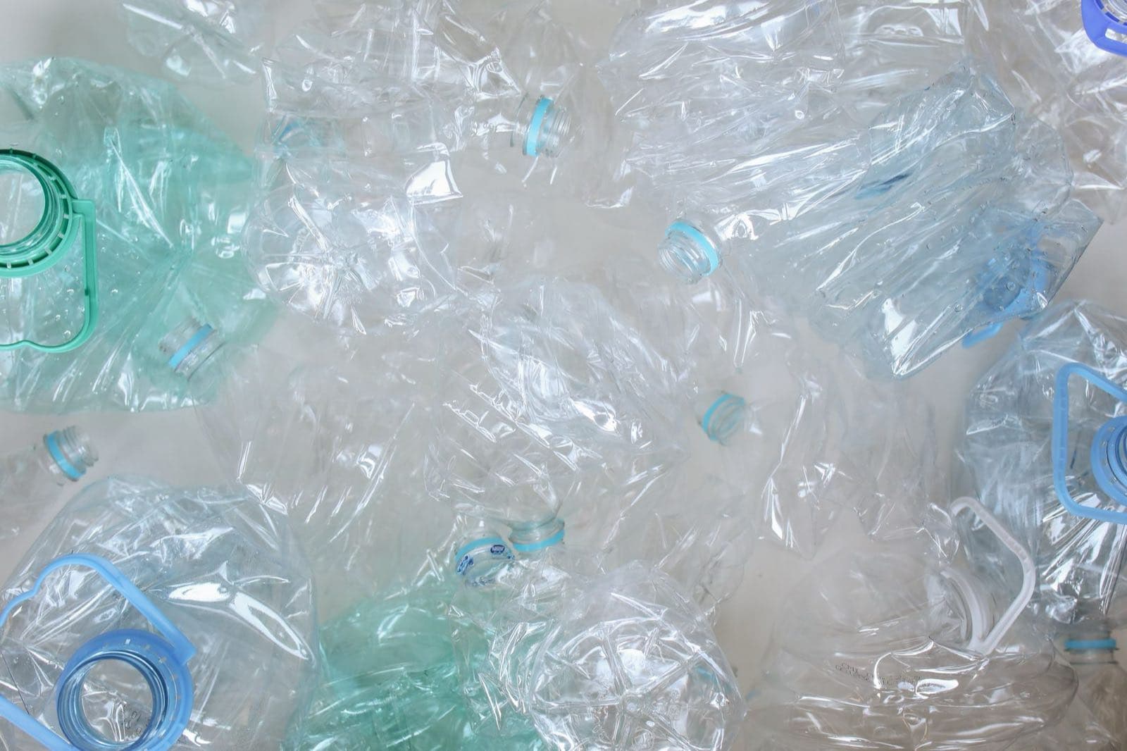 Clean, crushed PET plastic bottles collected and ready to be recycled into new material